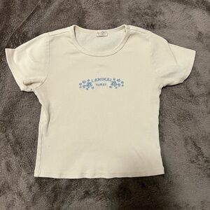 Brandy Melville Cream Crop Top with Blue Floral Design